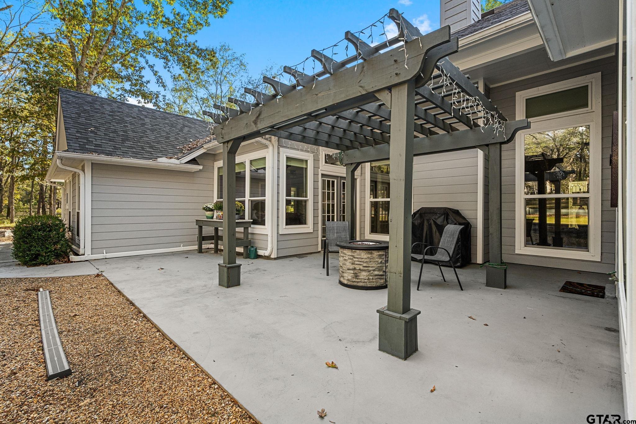 14417 East Ridge Road Arp, TX 75750 - Photo 30 of 47 a view of a porch with furniture and floor to ceiling window