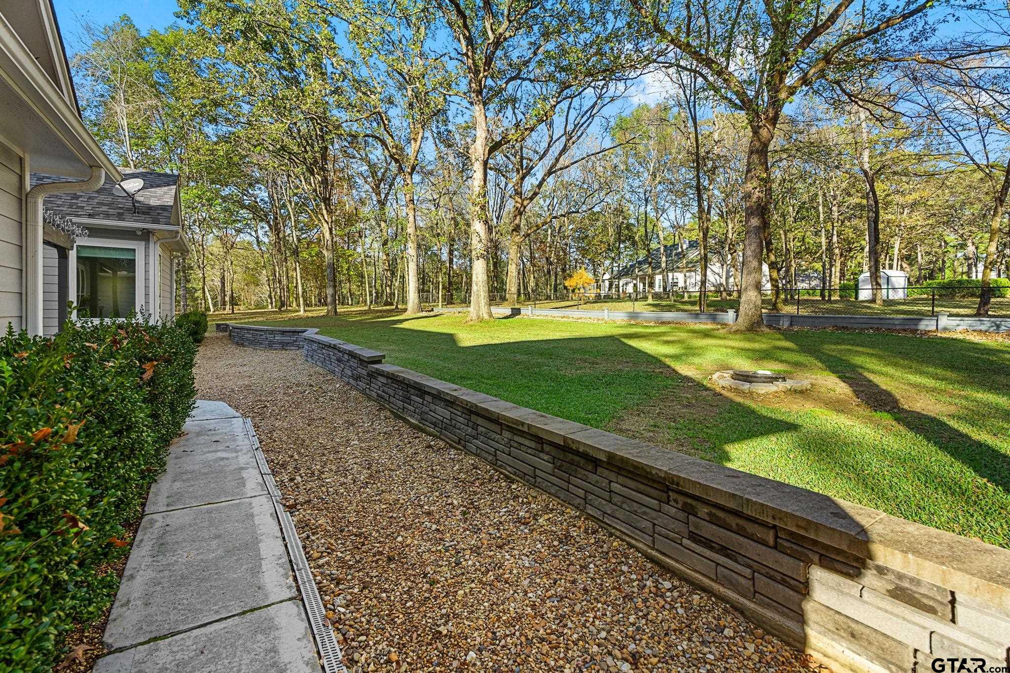 14417 East Ridge Road Arp, TX 75750 - Photo 32 of 47 a backyard of a house with lots of green space