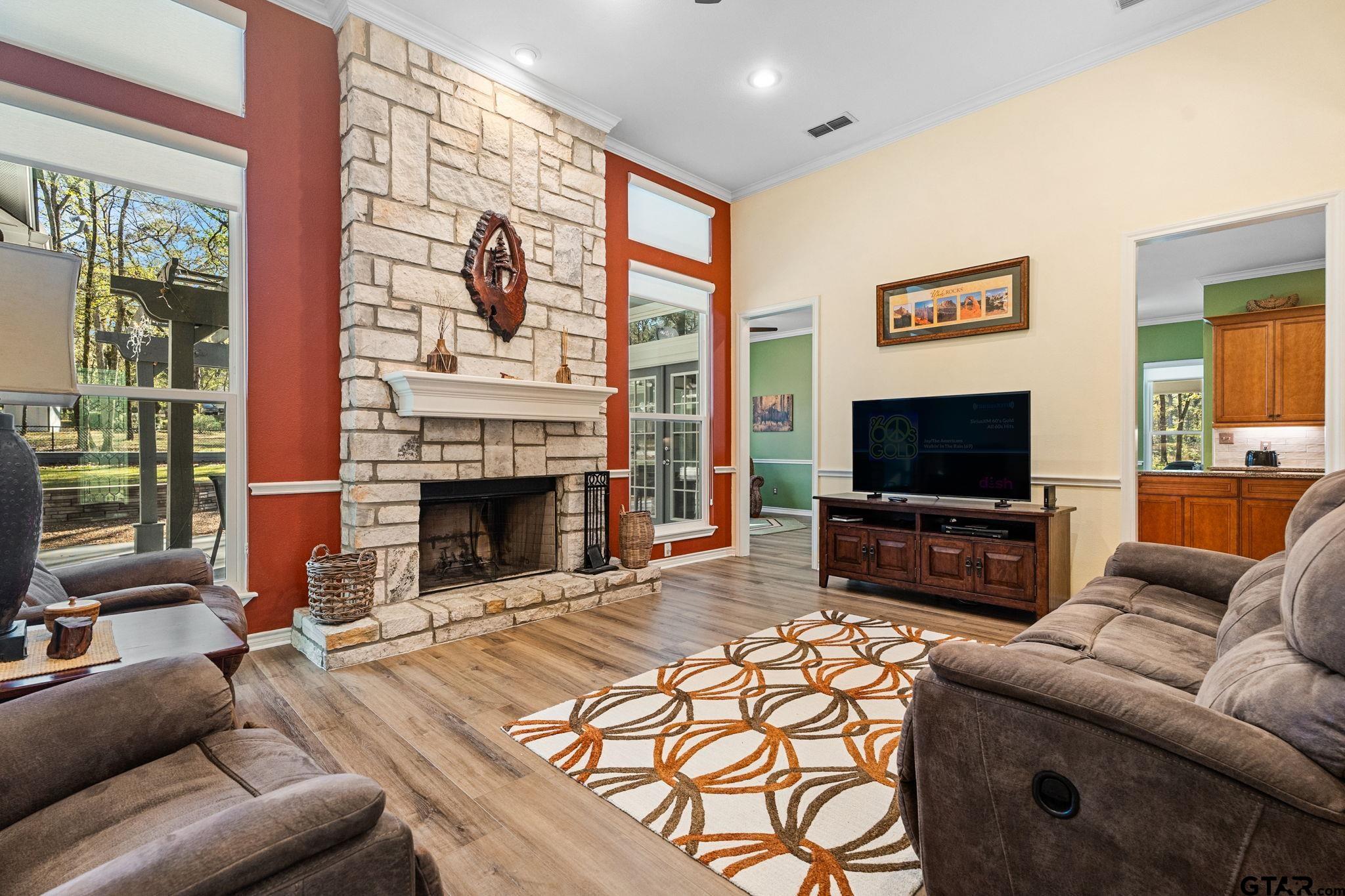 14417 East Ridge Road Arp, TX 75750 - Photo 9 of 47 a living room with furniture a flat screen tv and a fireplace