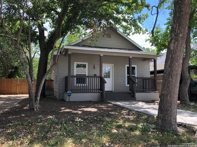 a view of a house with a tree and a tree