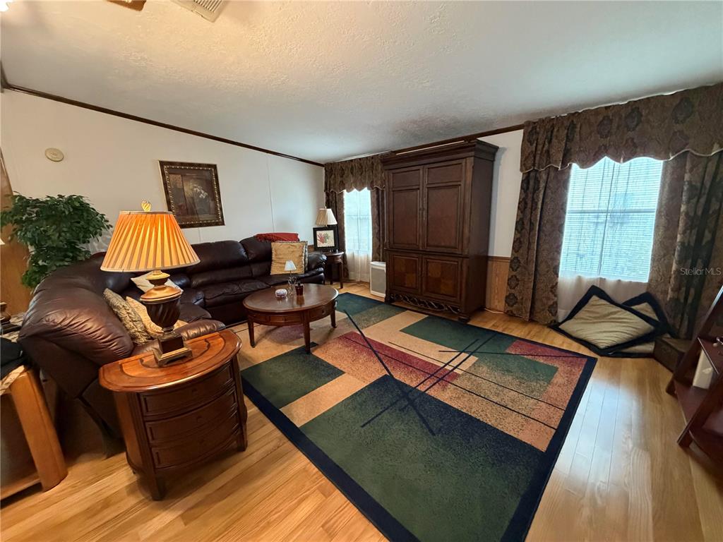 17 Meadowlark Circle Ellenton, FL 34222 - Photo 15 of 25 a living room with furniture and a window