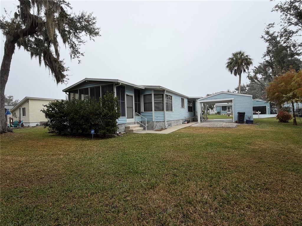 17 Meadowlark Circle Ellenton, FL 34222 - Photo 3 of 25 a front view of a house with garden