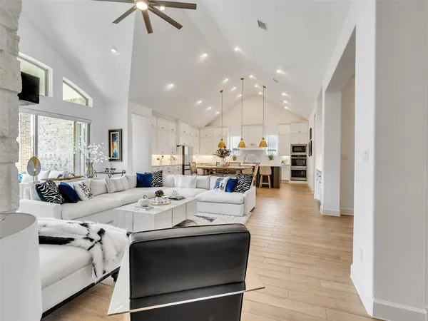 a kitchen with stainless steel appliances kitchen island granite countertop a stove and a refrigerator