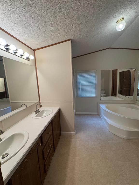 243 Springs Road Frierson, LA 71027 - Photo 13 of 23 a bathroom with a sink double vanity and a mirror