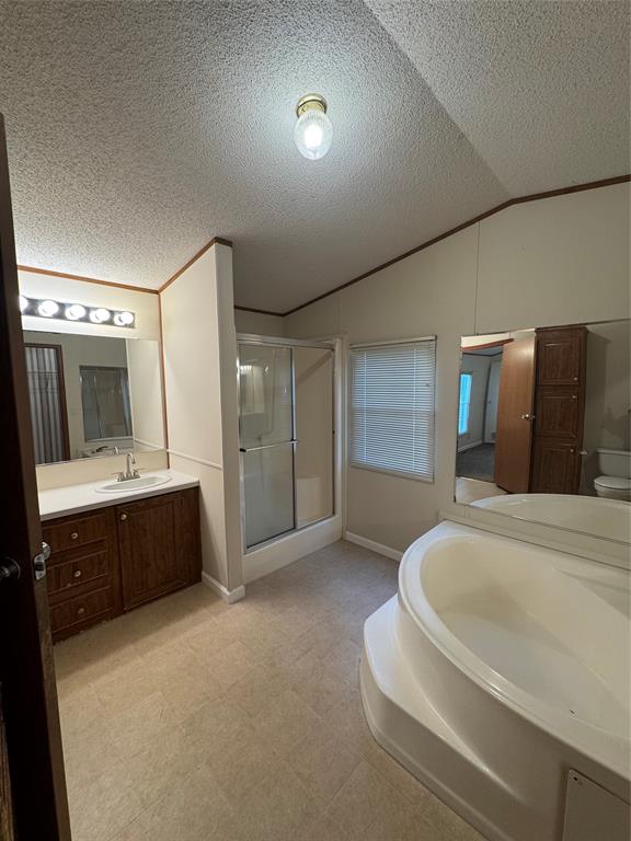 243 Springs Road Frierson, LA 71027 - Photo 15 of 23 a spacious bathroom with a double vanity sink and a mirror