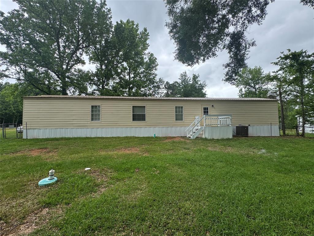 243 Springs Road Frierson, LA 71027 - Photo 20 of 23 a view of a backyard with large trees