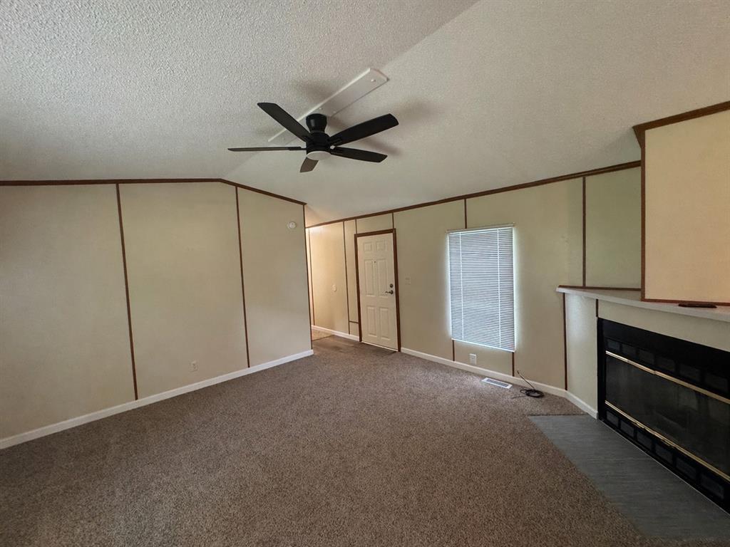 243 Springs Road Frierson, LA 71027 - Photo 4 of 23 a view of an empty room with a fireplace