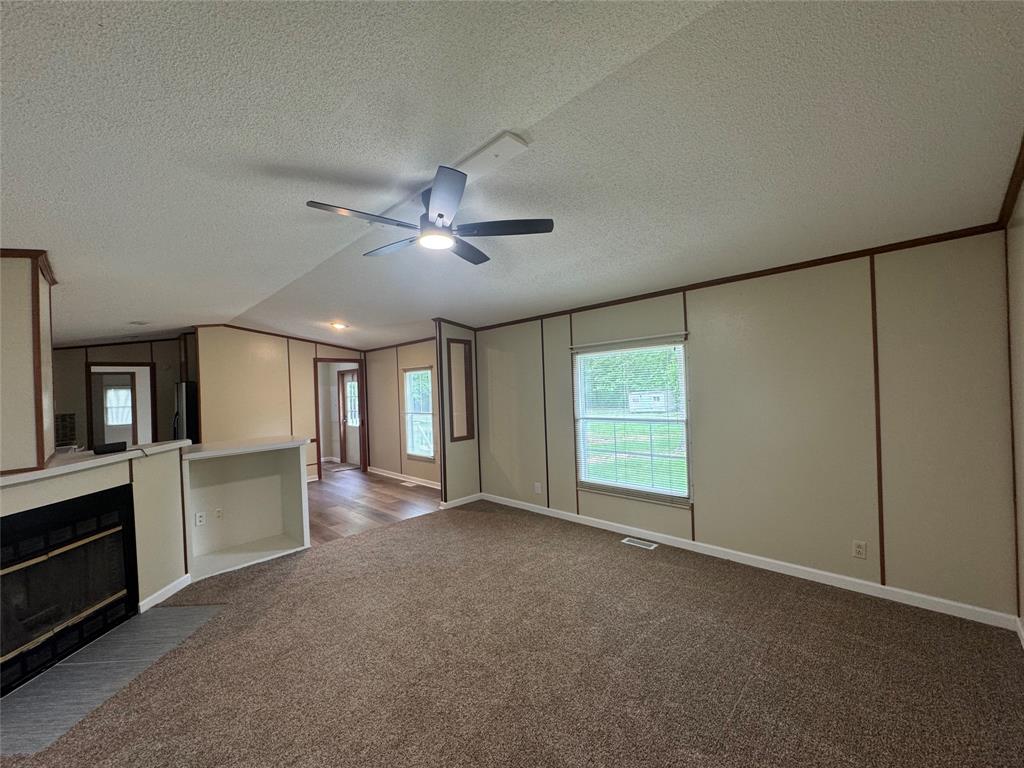 243 Springs Road Frierson, LA 71027 - Photo 5 of 23 a view of an empty room with window and cabinet
