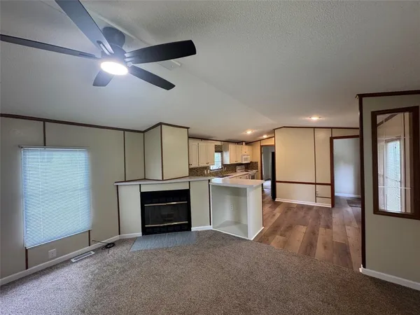 a view of a kitchen with a sink and dishwasher cabinets