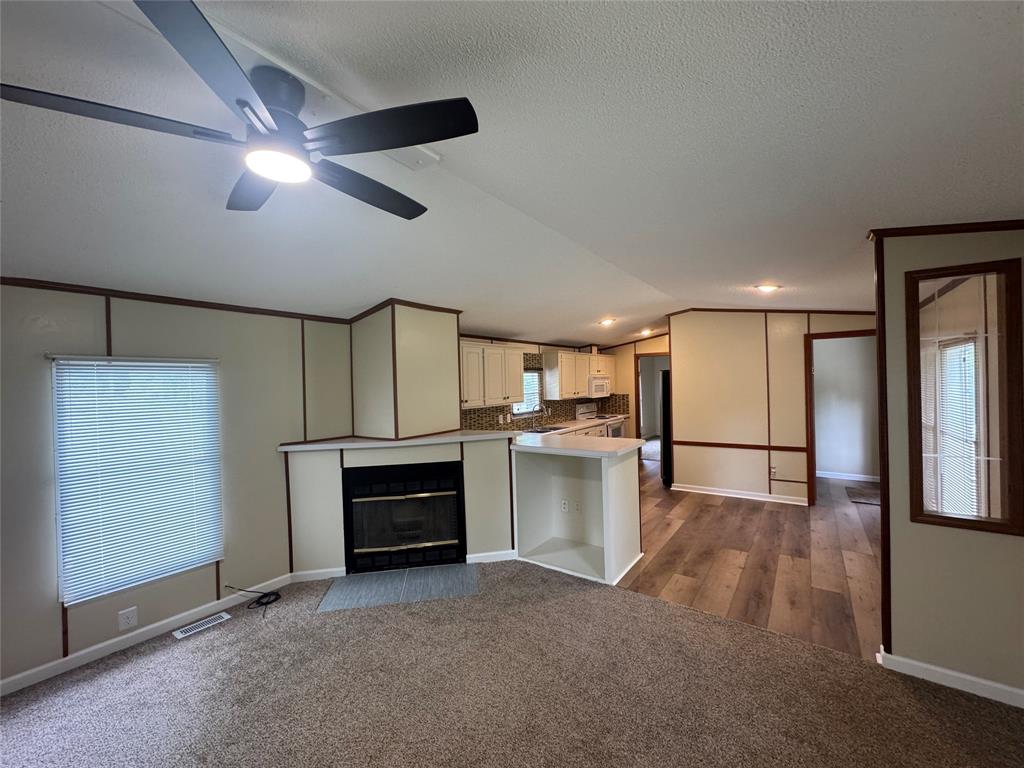 243 Springs Road Frierson, LA 71027 - Photo 6 of 23 a view of a kitchen with a sink and dishwasher cabinets
