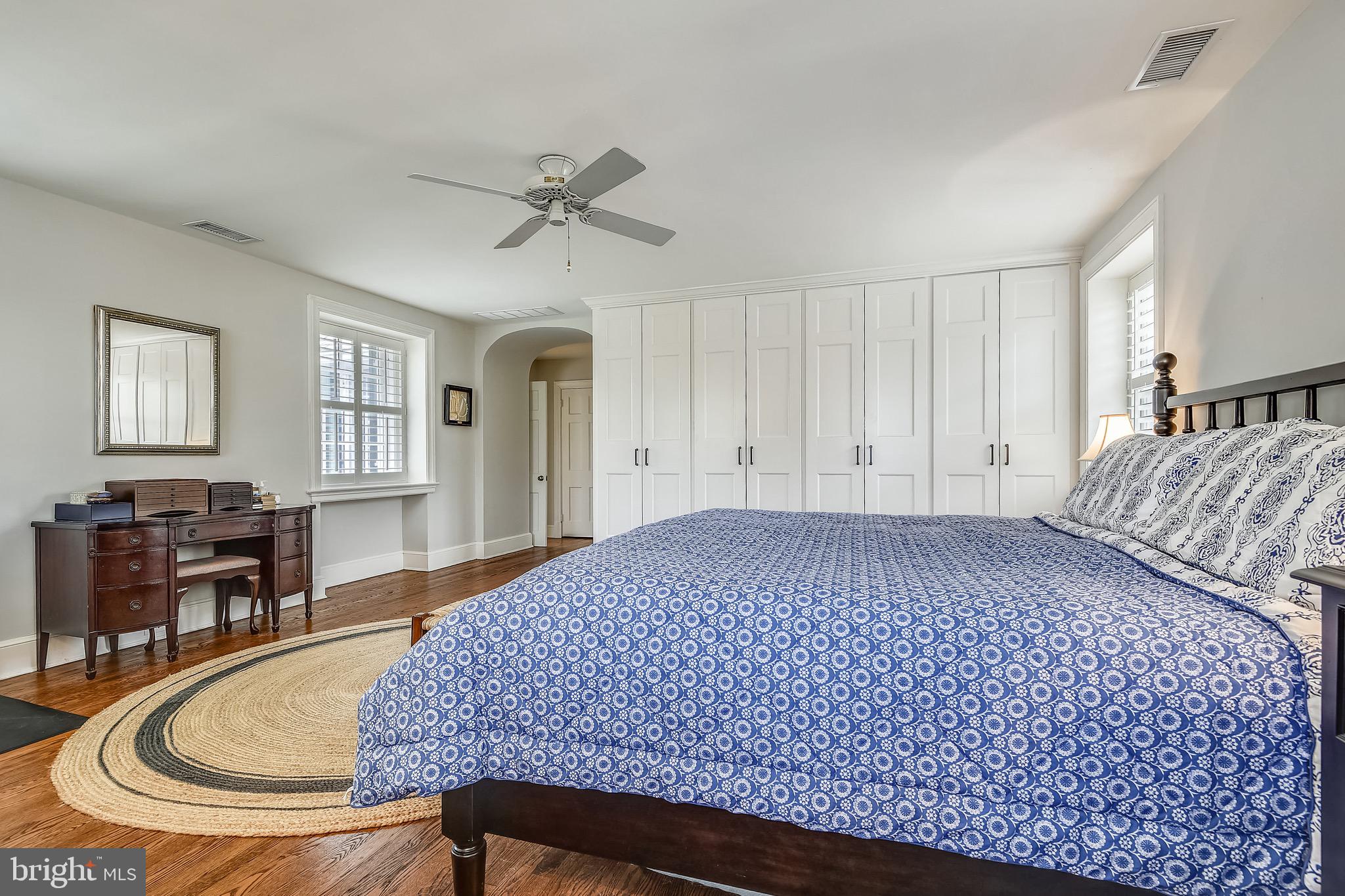105 Tunbridge Road Baltimore, MD 21212 - Photo 27 of 62 a bed sitting in a spacious bedroom next to a window and a chandelier