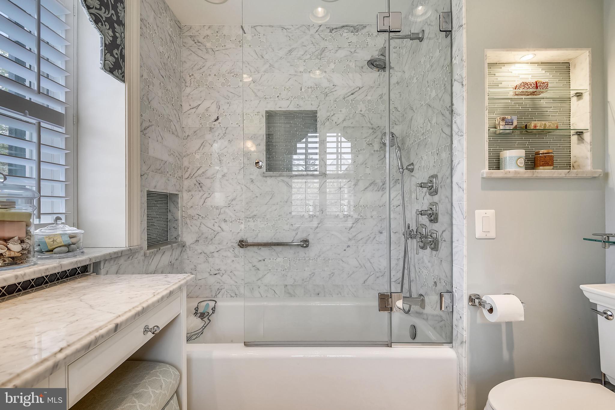 105 Tunbridge Road Baltimore, MD 21212 - Photo 30 of 62 a bathroom with a granite countertop sink a toilet and shower