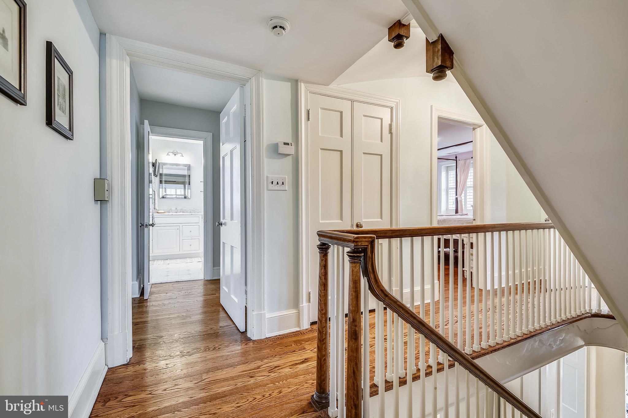 105 Tunbridge Road Baltimore, MD 21212 - Photo 35 of 62 a view of a hallway with wooden floor and staircase