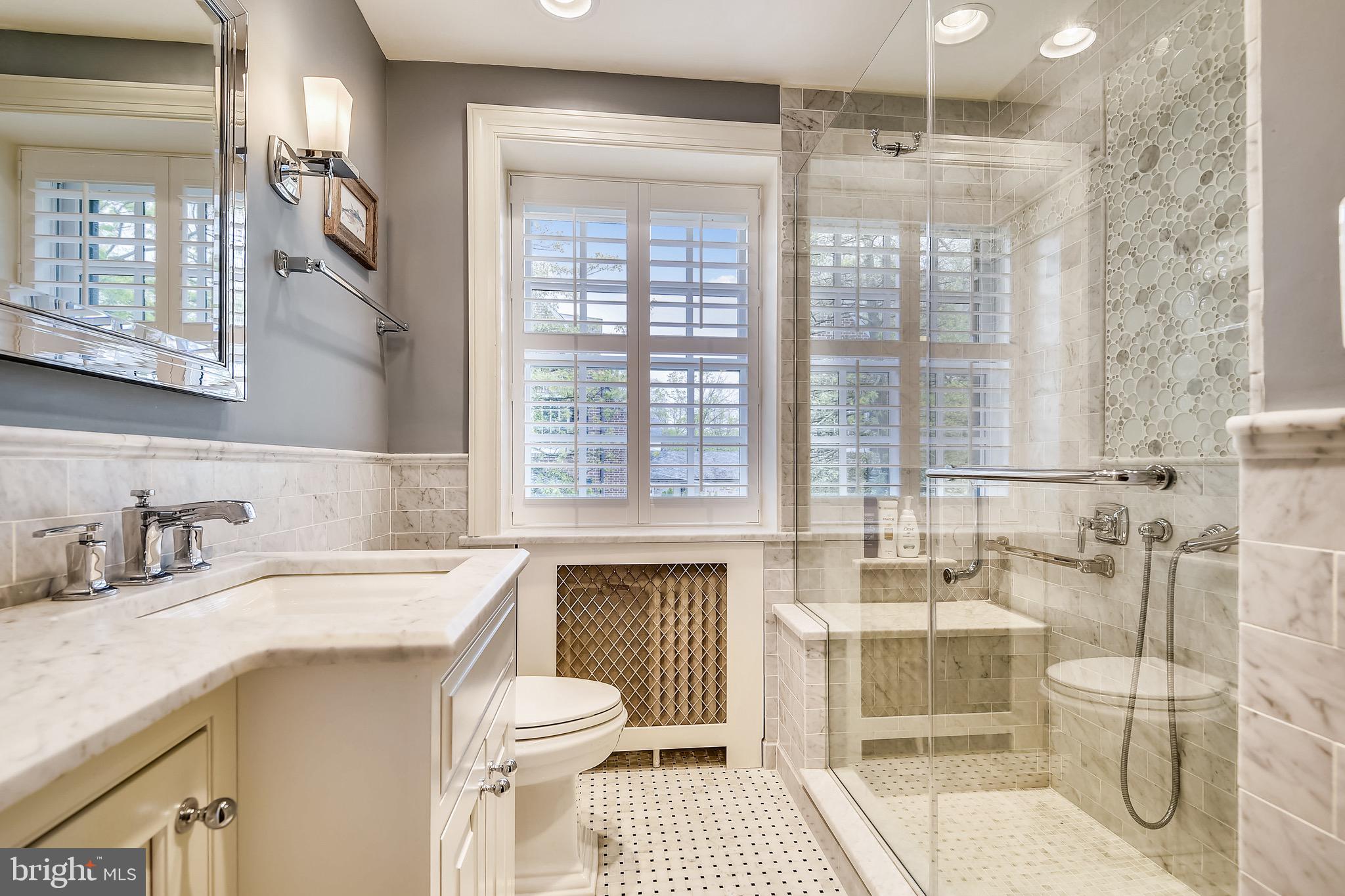 105 Tunbridge Road Baltimore, MD 21212 - Photo 36 of 62 a bathroom with a sink double vanity and a toilet