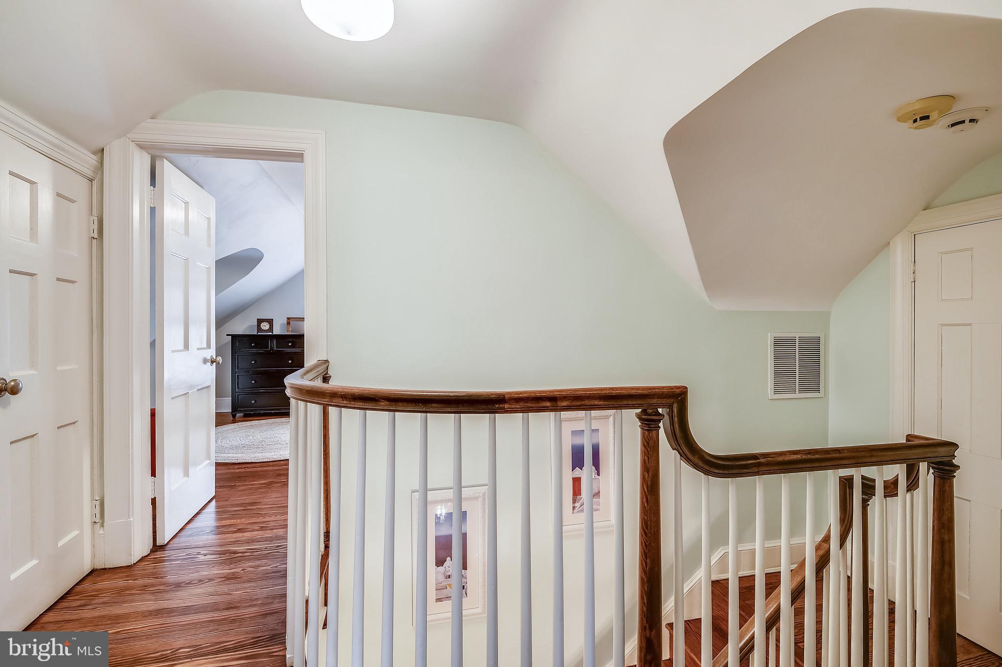 105 Tunbridge Road Baltimore, MD 21212 - Photo 42 of 62 a view of a hallway with wooden floor and staircase