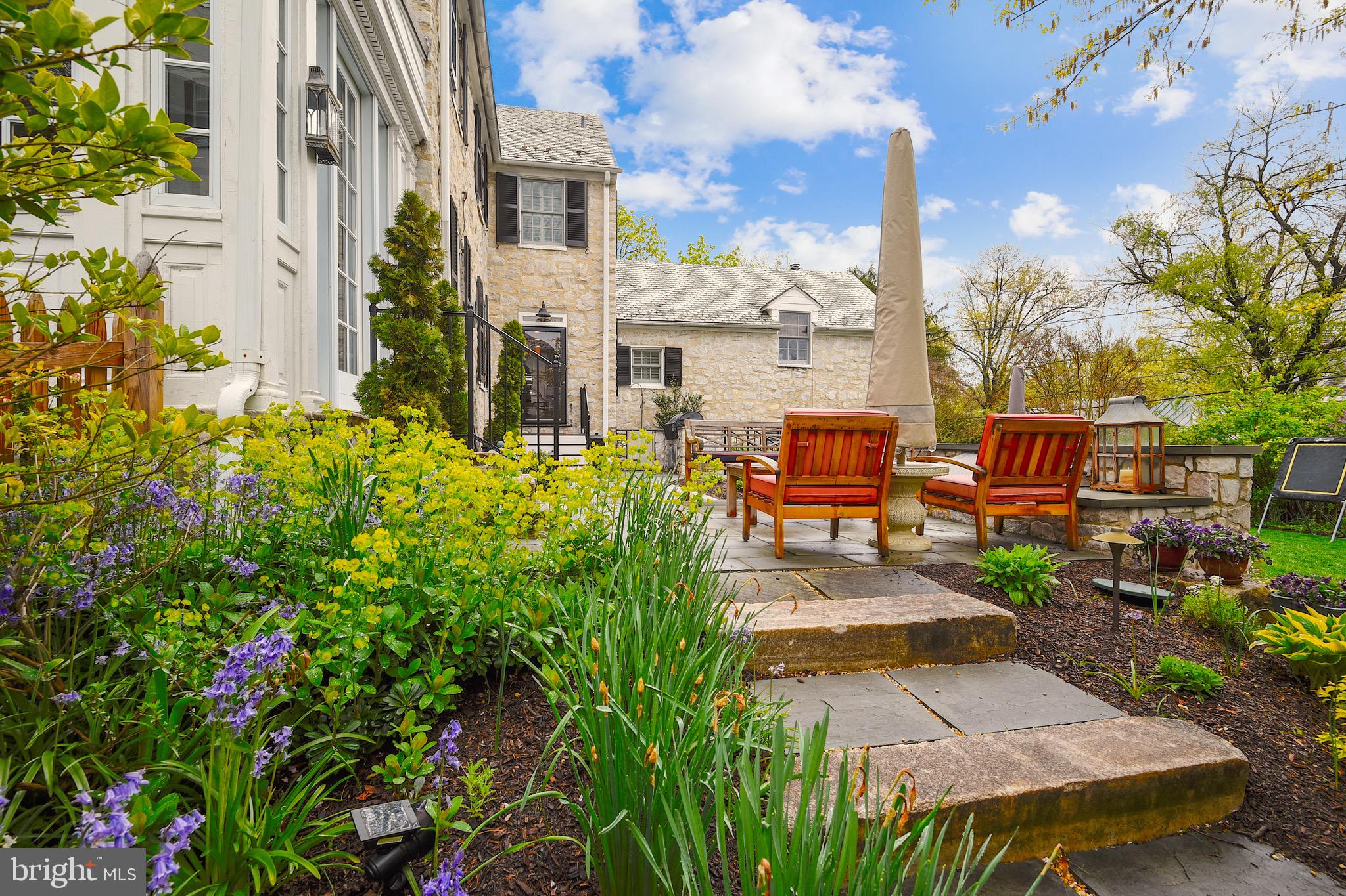 105 Tunbridge Road Baltimore, MD 21212 - Photo 48 of 62 a view of a patio with couches table and chairs and potted plants