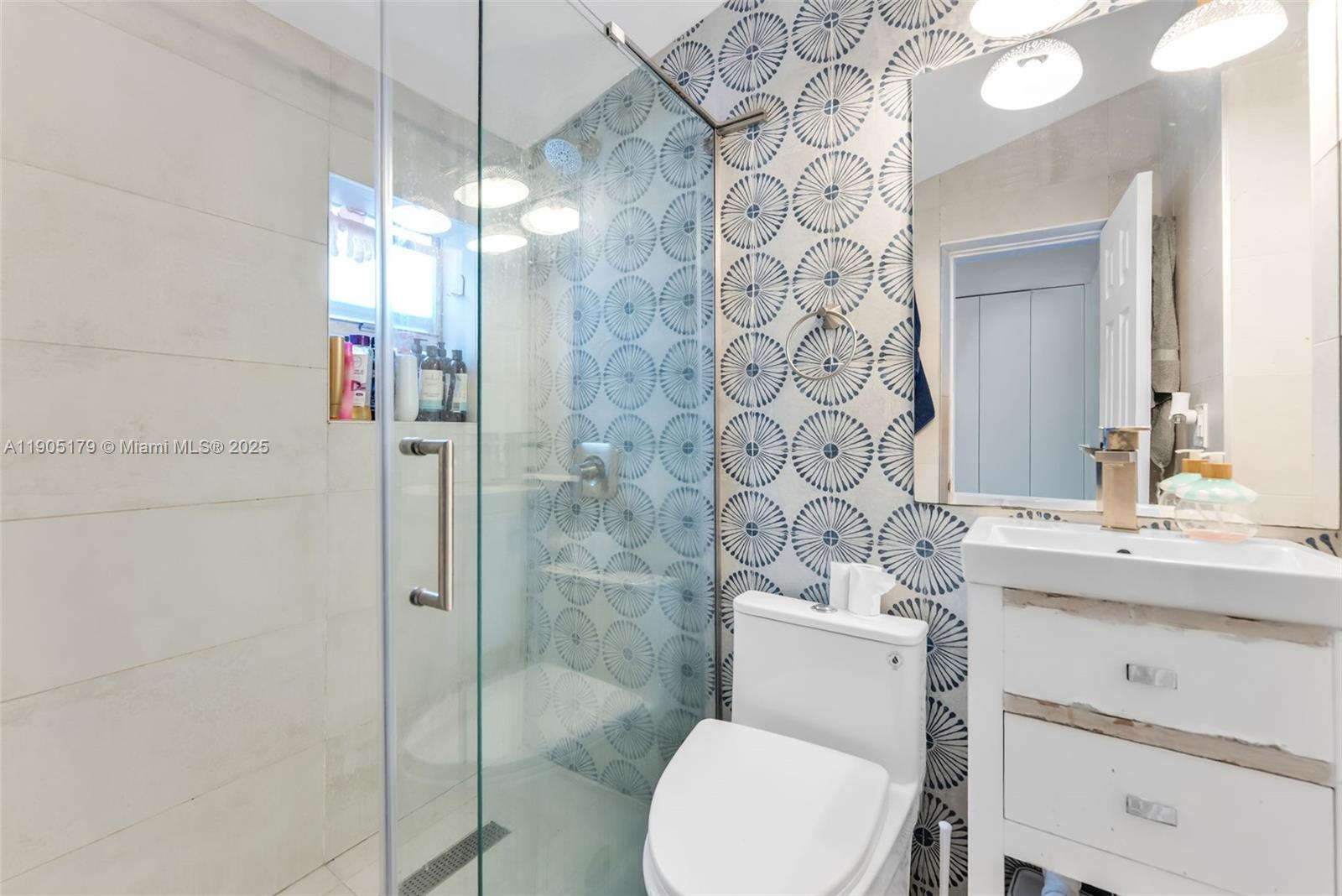 1105 Northeast 10th Street Hallandale Beach, FL 33009 - Photo 17 of 28 a bathroom with a sink toilet and shower