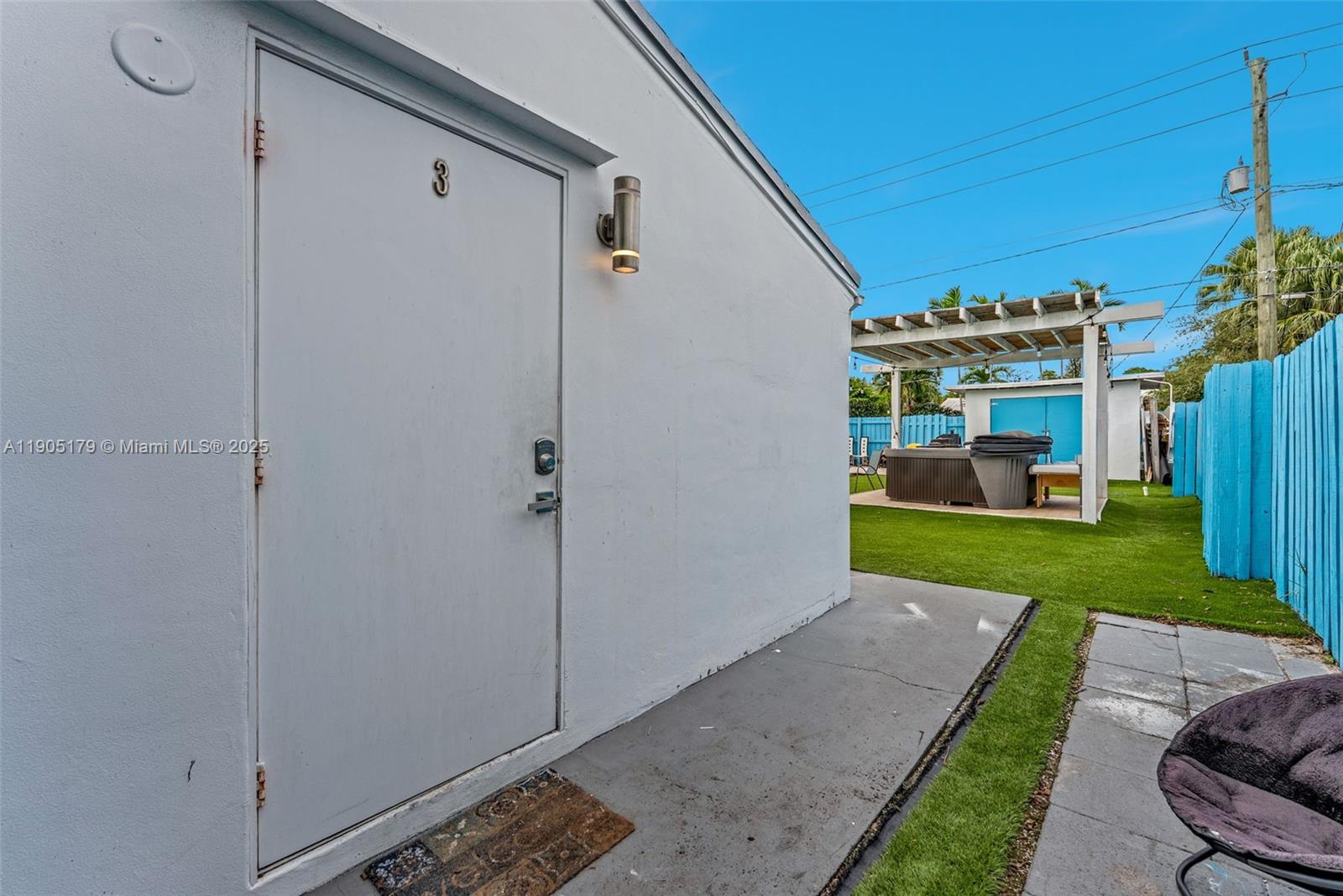 1105 Northeast 10th Street Hallandale Beach, FL 33009 - Photo 19 of 28 a view of a porch with furniture and a yard
