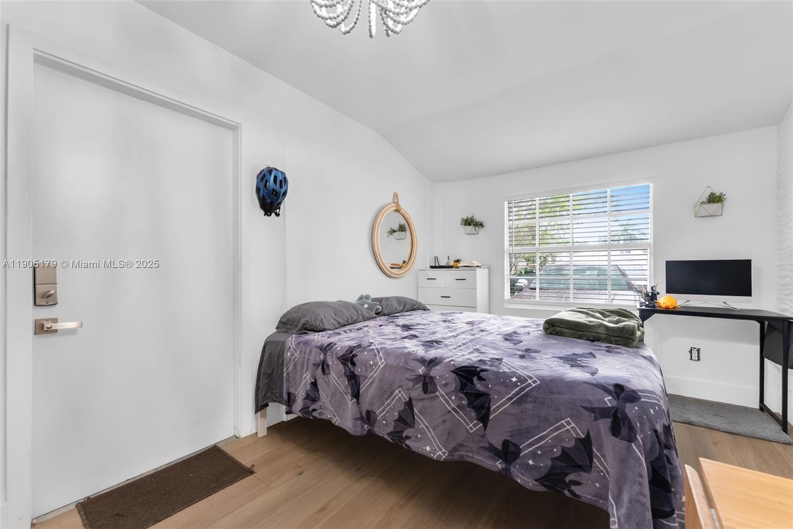 1105 Northeast 10th Street Hallandale Beach, FL 33009 - Photo 21 of 28 a bedroom with a bed and window