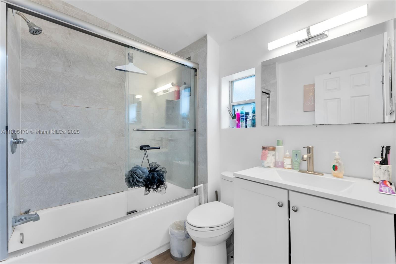 1105 Northeast 10th Street Hallandale Beach, FL 33009 - Photo 24 of 28 a bathroom with a sink toilet and shower