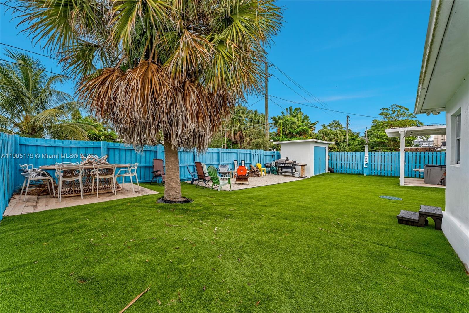 1105 Northeast 10th Street Hallandale Beach, FL 33009 - Photo 28 of 28 a house view with a sitting space garden and patio