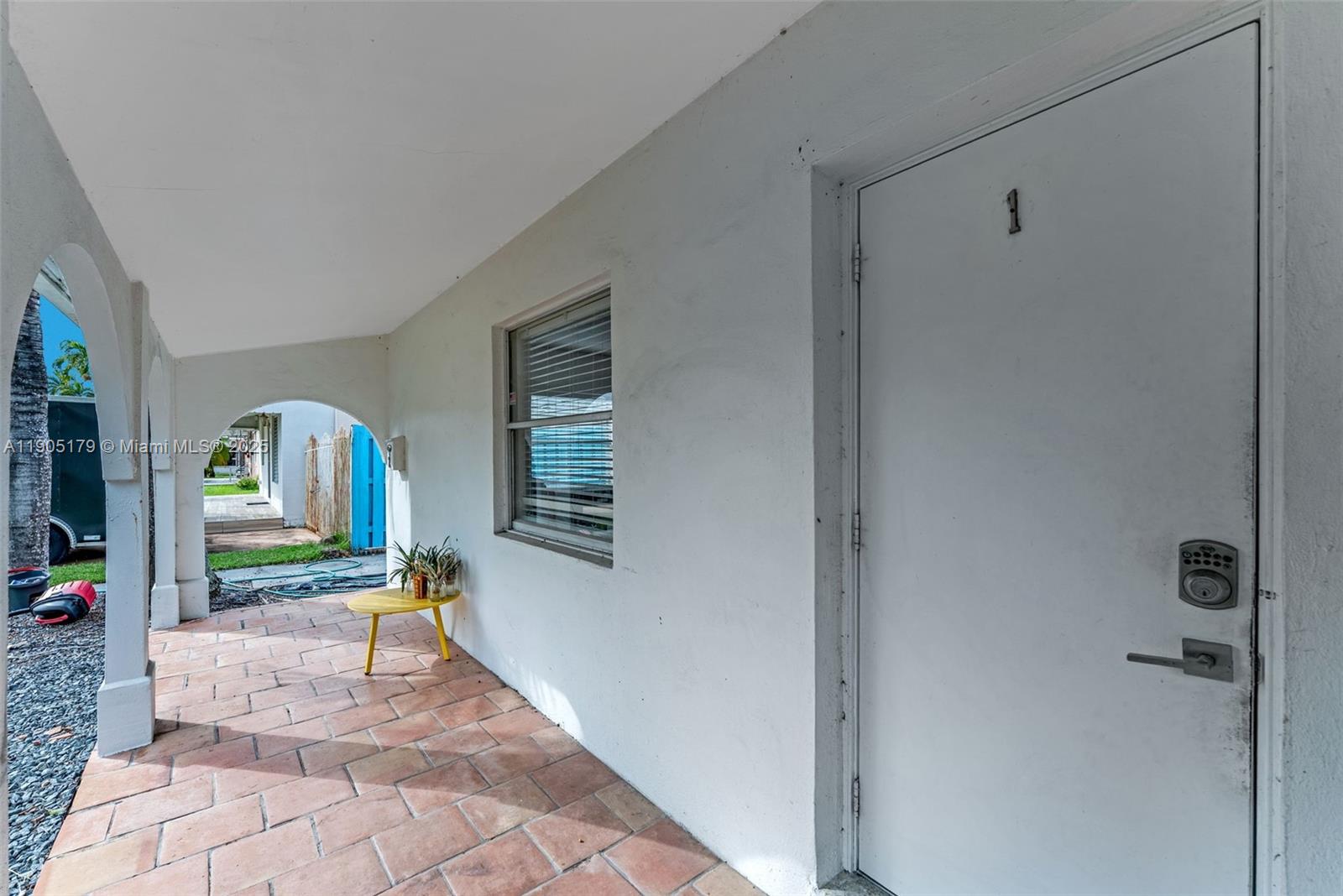 1105 Northeast 10th Street Hallandale Beach, FL 33009 - Photo 4 of 28 a living room with furniture and a table