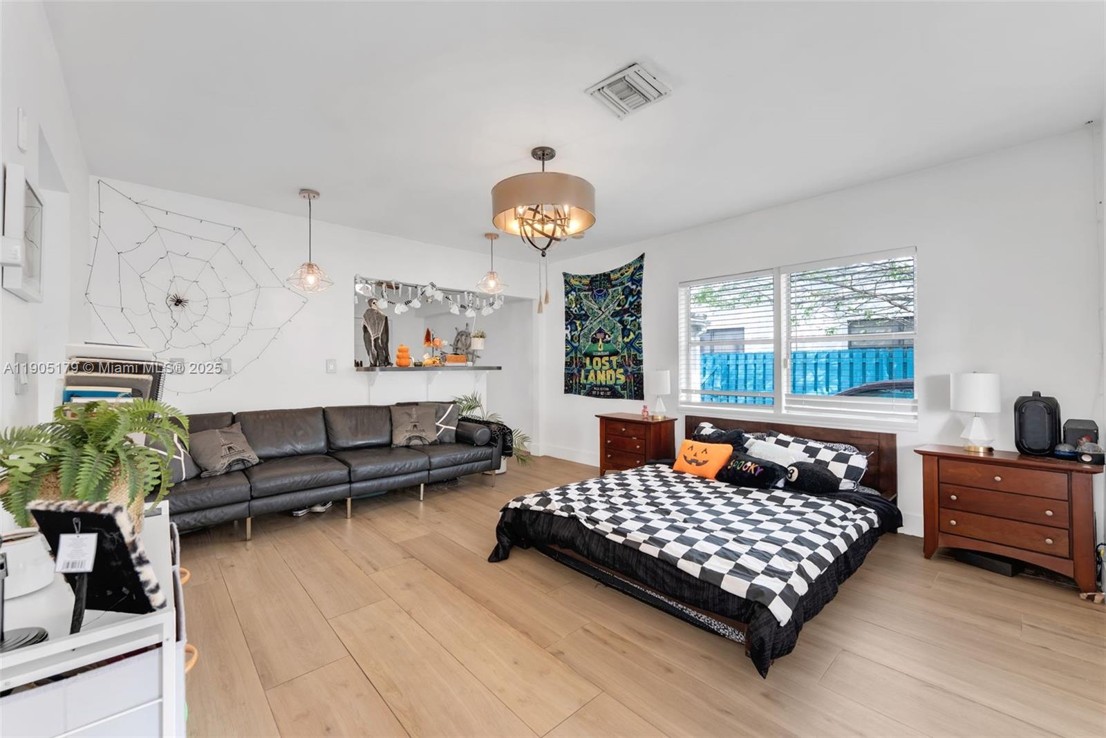 1105 Northeast 10th Street Hallandale Beach, FL 33009 - Photo 5 of 28 a bedroom with bed and window