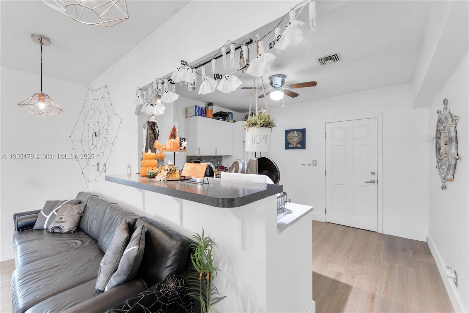 1105 Northeast 10th Street Hallandale Beach, FL 33009 - Photo 7 of 28 a view of kitchen and living room