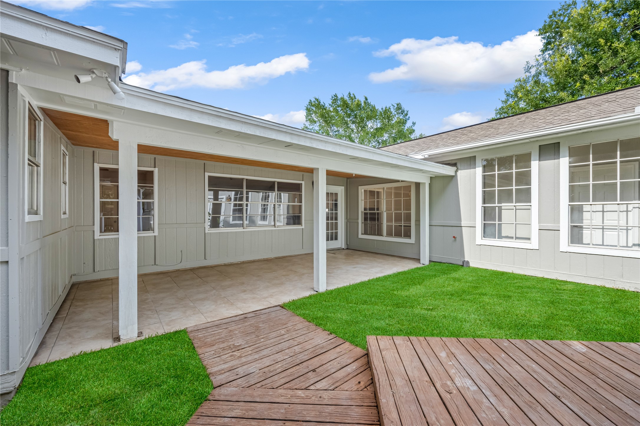 9806 Tanager Lane Conroe, TX 77385 - Photo 5 of 28 a view of a house with a yard and potted plants