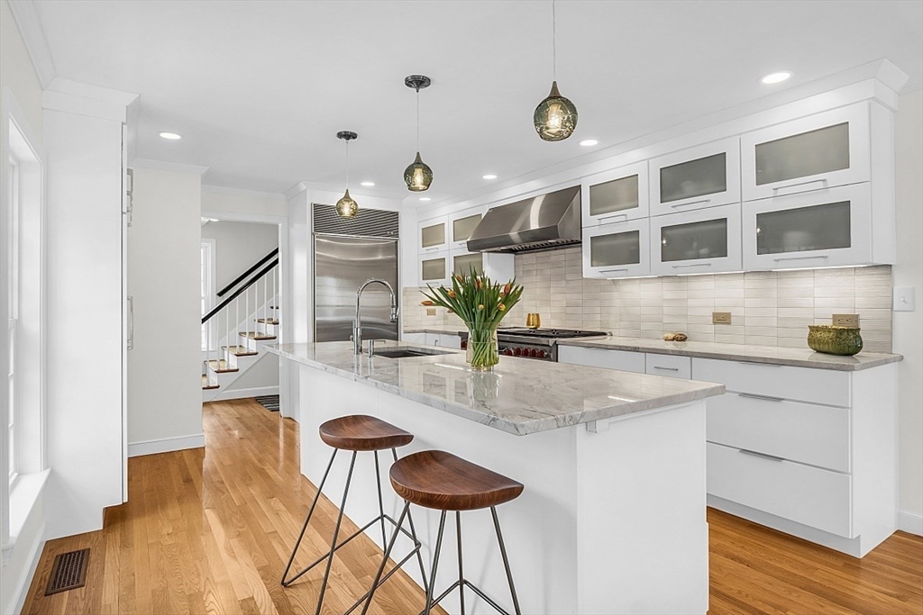 18 Edmonds Road, Unit 18 Concord, MA 01742 - Photo 3 of 27 a kitchen with stainless steel appliances granite countertop a dining table chairs and granite counter tops