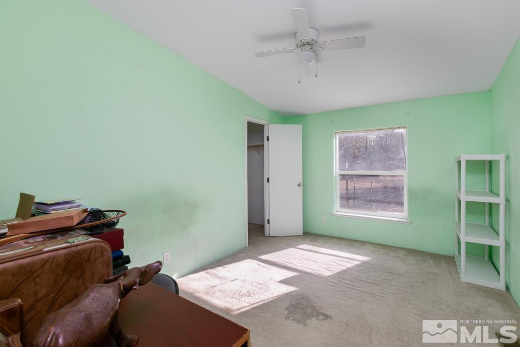 5605 Alcorn Road Fallon, NV 89406 - Photo 18 of 35 a bed room with a bed and a window