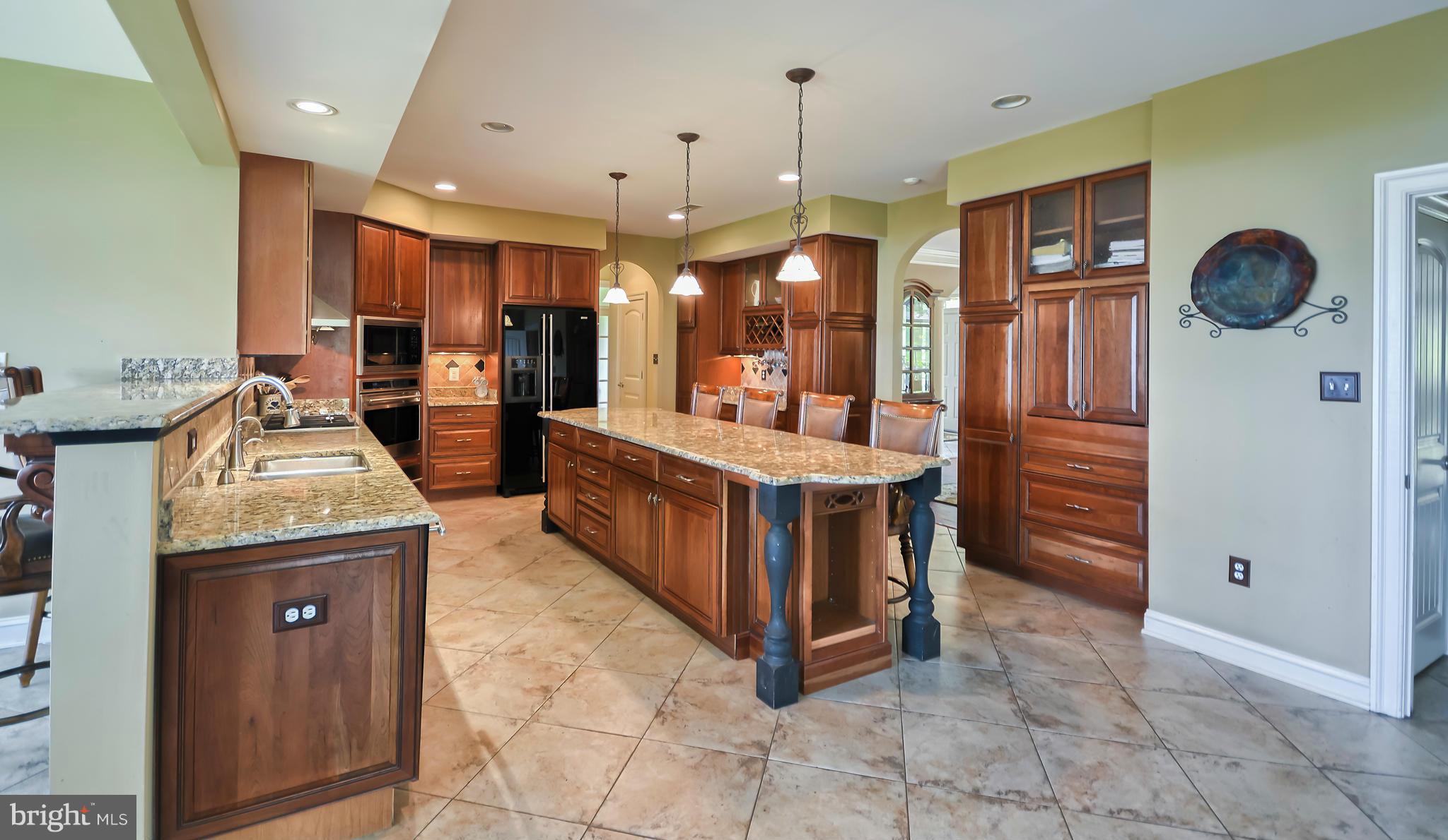4522 Coxey Brown Road Myersville, MD 21773 - Photo 14 of 30 a large kitchen with stainless steel appliances granite countertop a stove and a sink