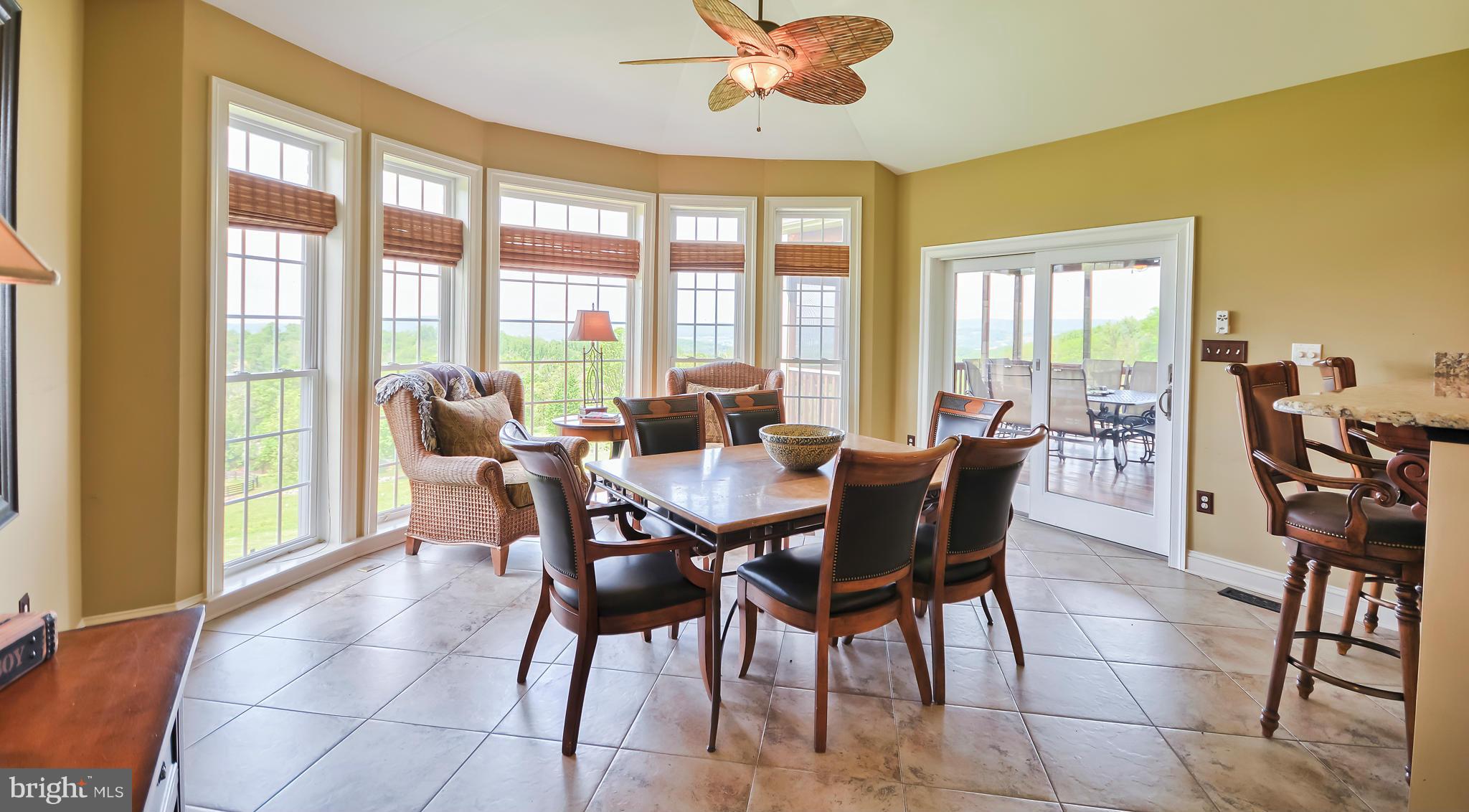 4522 Coxey Brown Road Myersville, MD 21773 - Photo 16 of 30 a dining room with furniture a chandelier and a rug