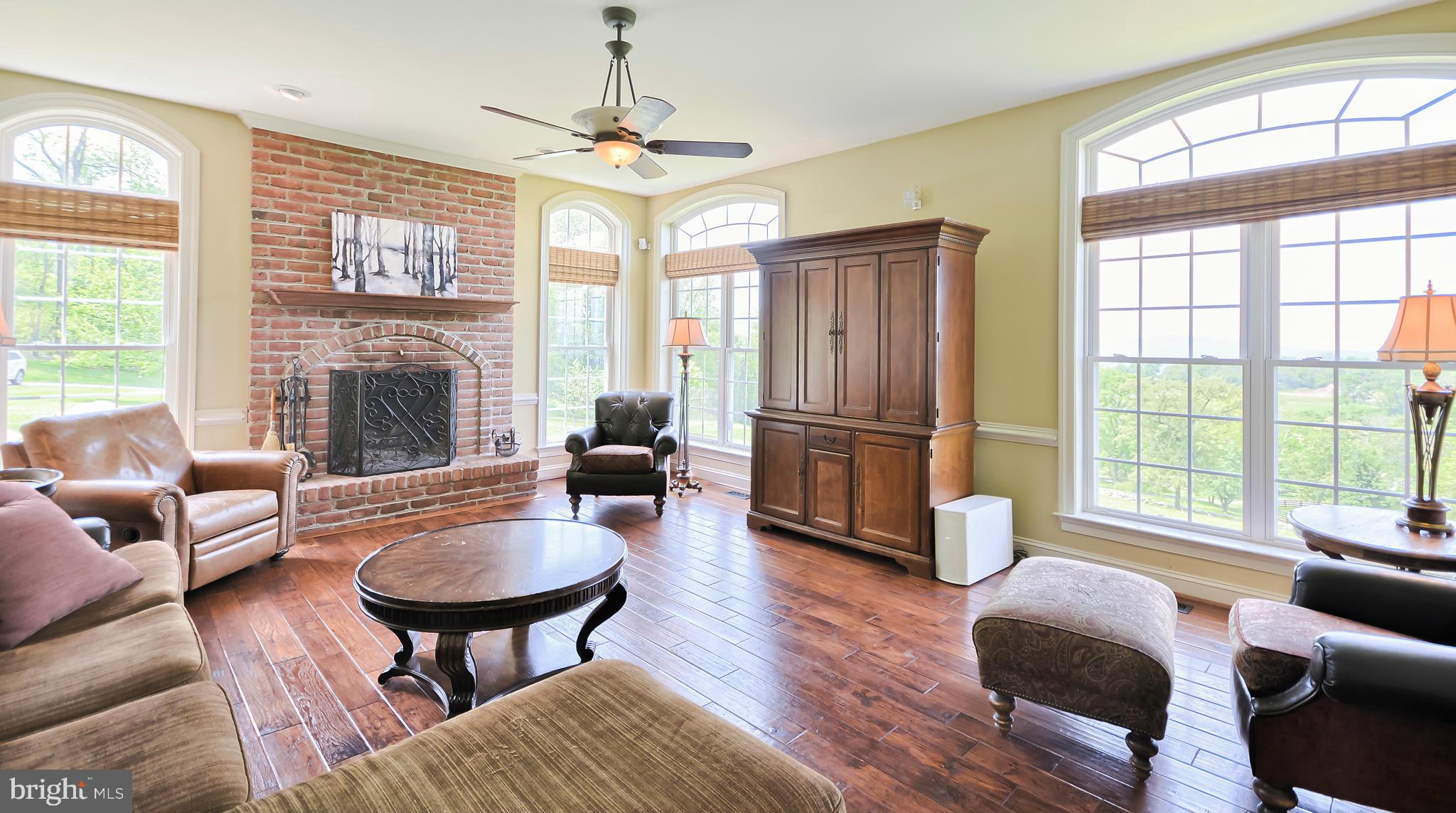 4522 Coxey Brown Road Myersville, MD 21773 - Photo 17 of 30 a living room with furniture fireplace and a large window