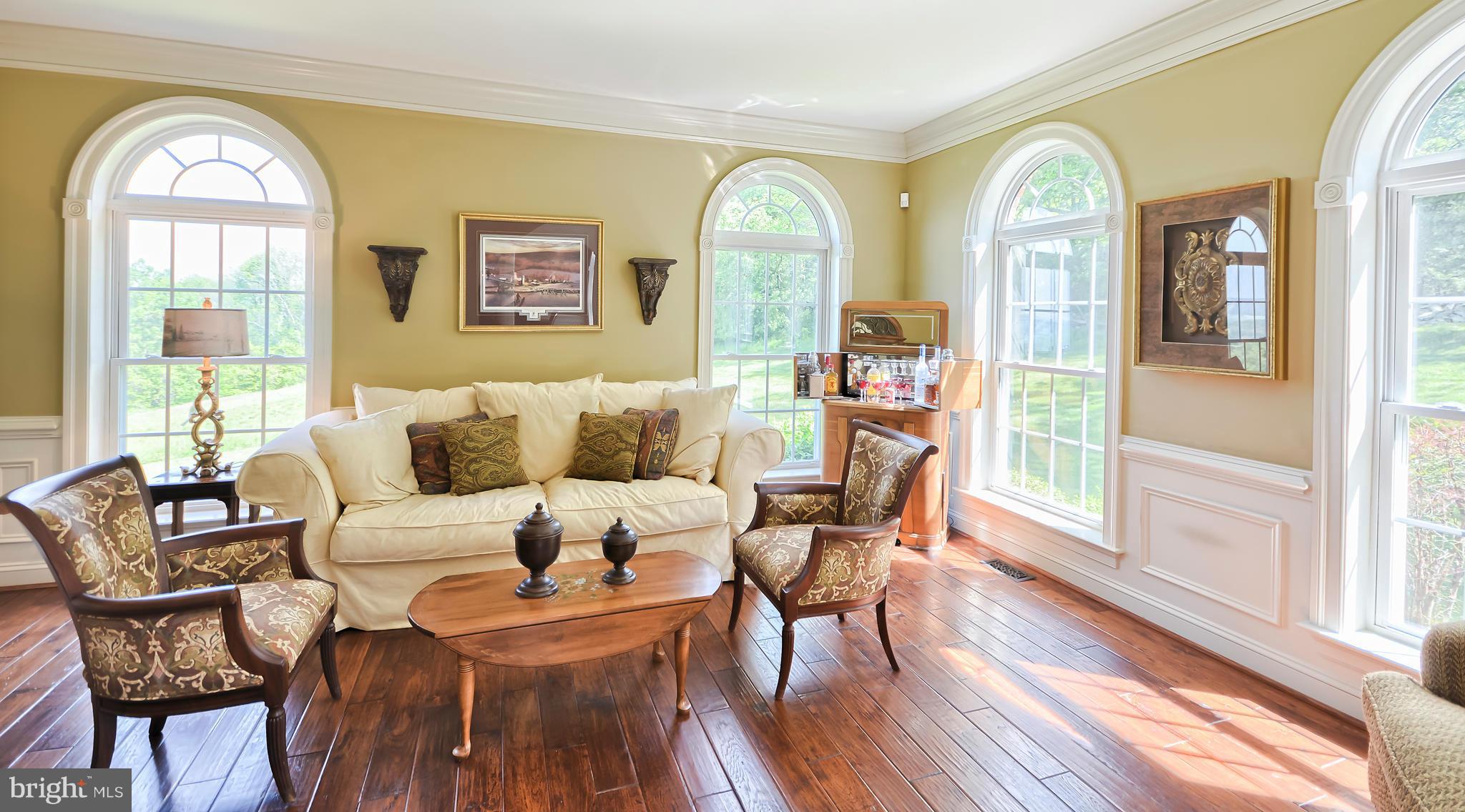 4522 Coxey Brown Road Myersville, MD 21773 - Photo 9 of 30 a living room with furniture a wooden floor and a large window