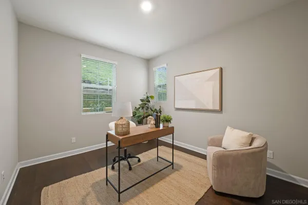 a work room with furniture and a window