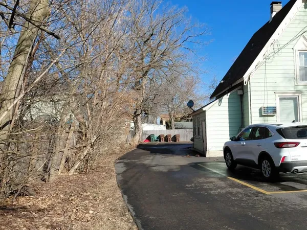 a view of a cars park in front of house