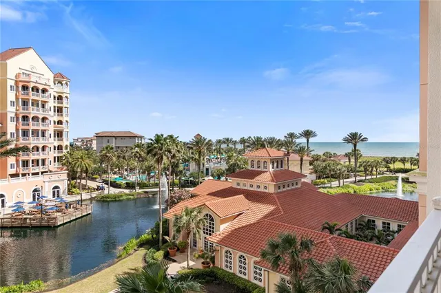 a kitchen with granite countertop a refrigerator stove and microwave