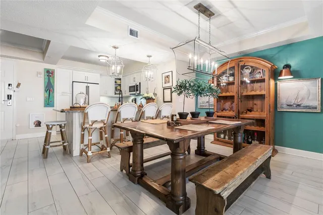a kitchen with stainless steel appliances kitchen island granite countertop a refrigerator and a sink