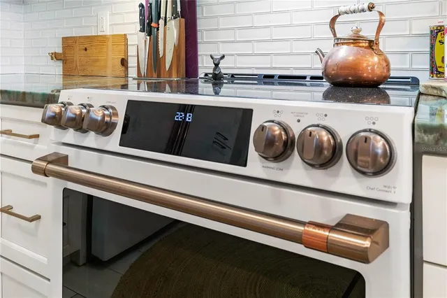 a bathroom with a double vanity sink mirror and bathtub