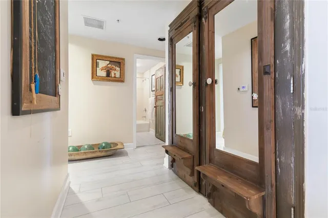 a bathroom with a toilet a sink a vanity and mirror