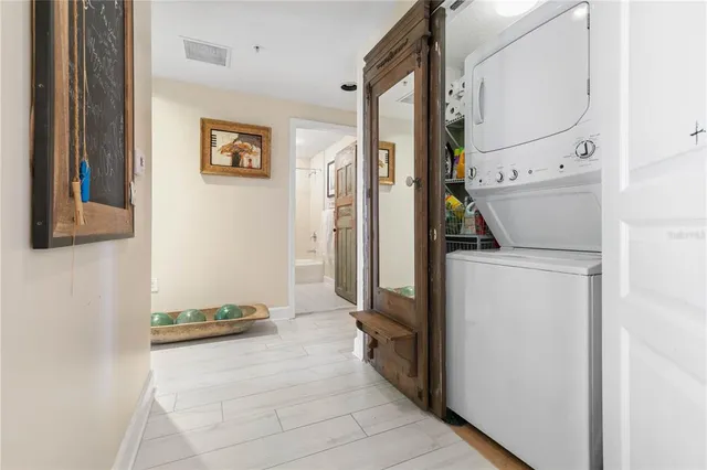 a front view of a house with a garden and trees