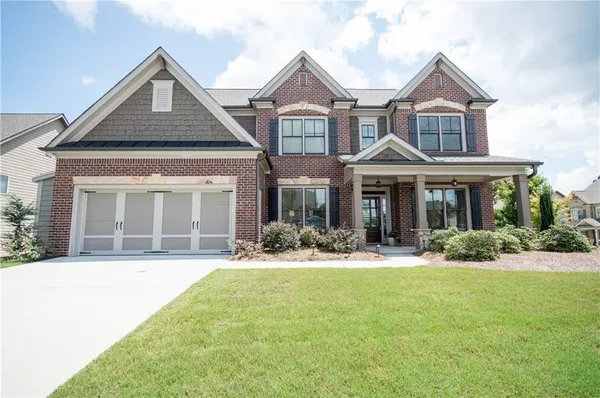 front view of a house with a yard