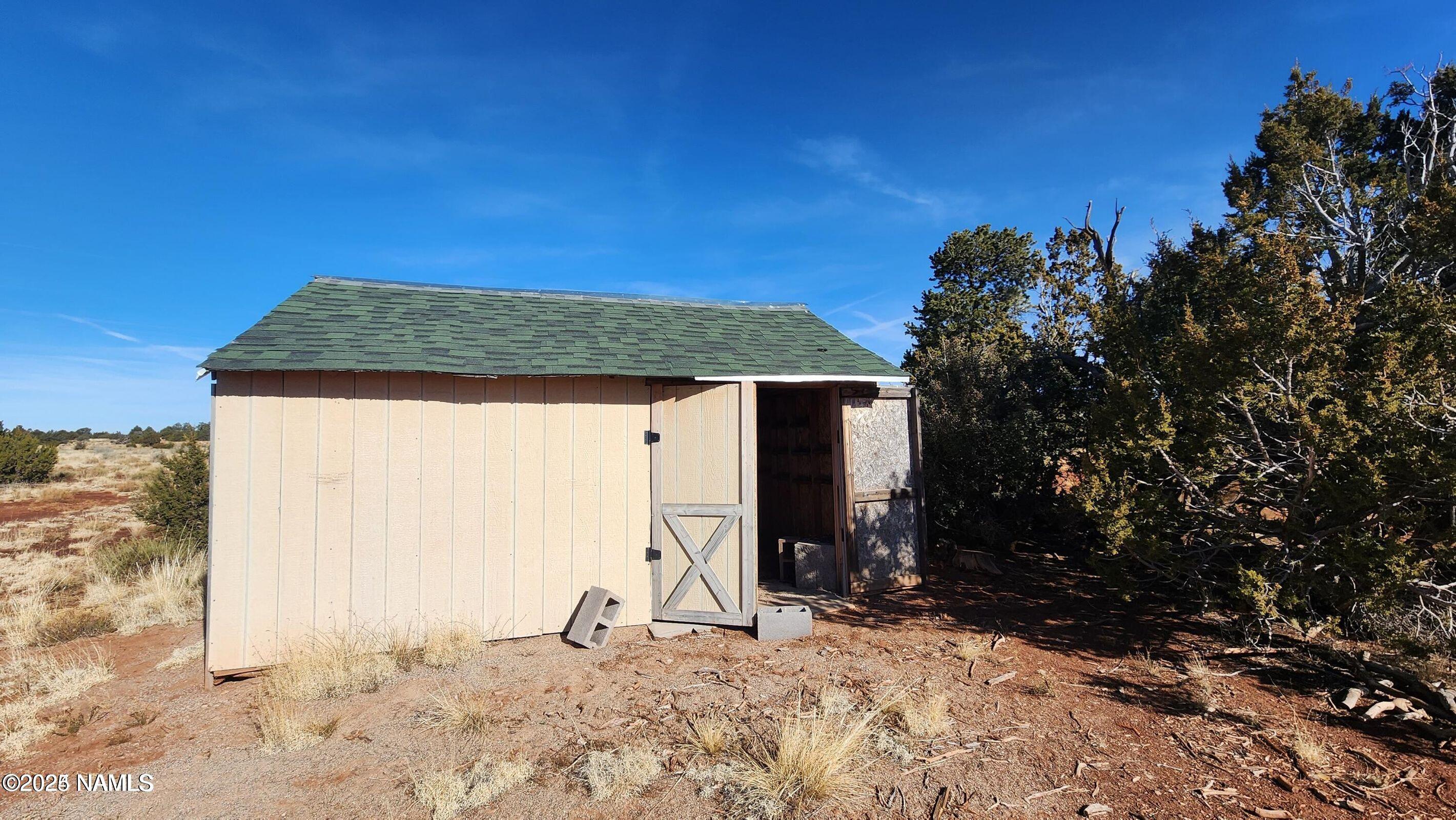 4378 Lasso Loop Williams, AZ 86046 - Photo 9 of 29 a view of a backyard with a tree