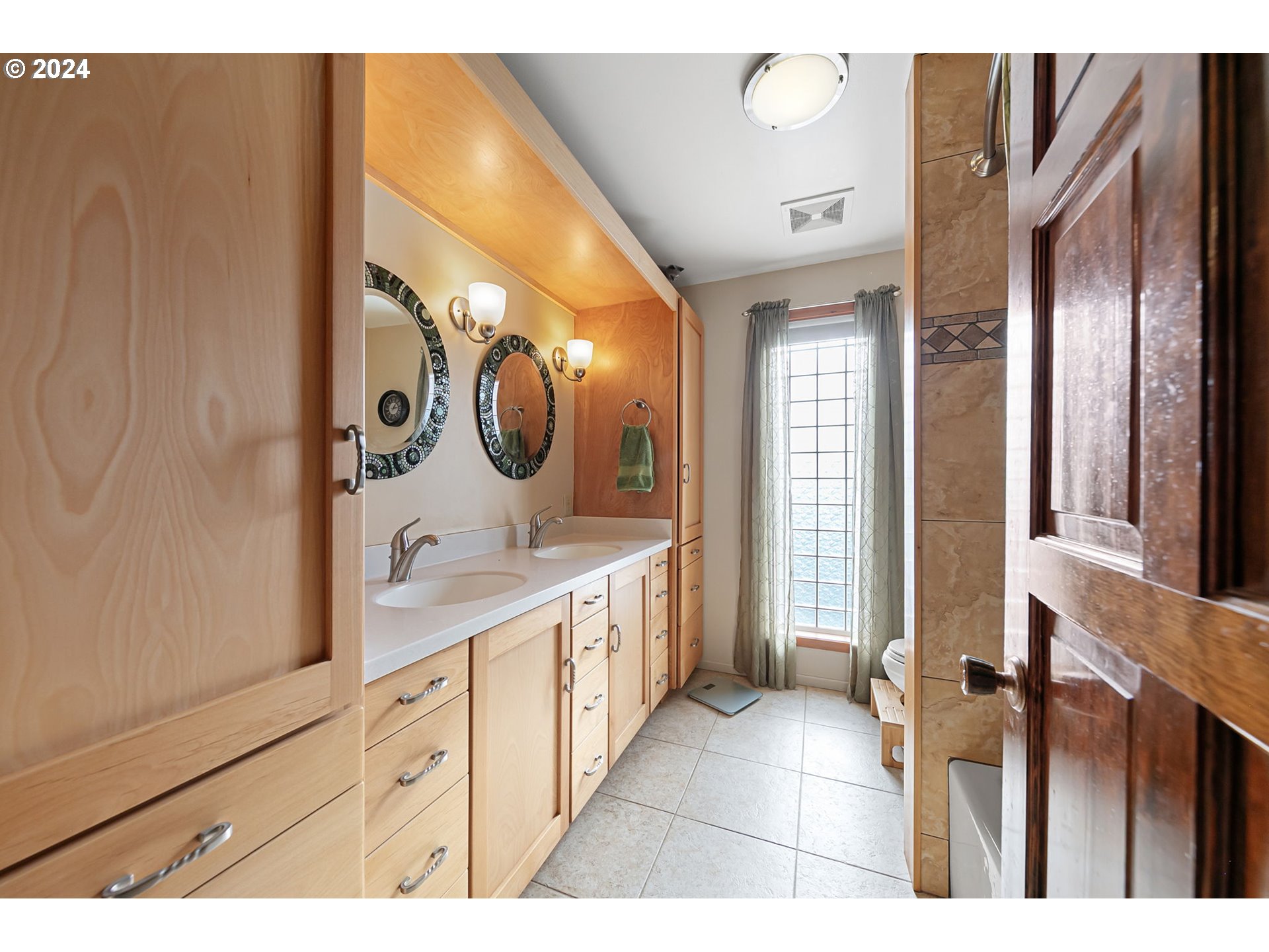 37797 Worth Road Springfield, OR 97478 - Photo 28 of 47 a spacious bathroom with a mirror and a sink
