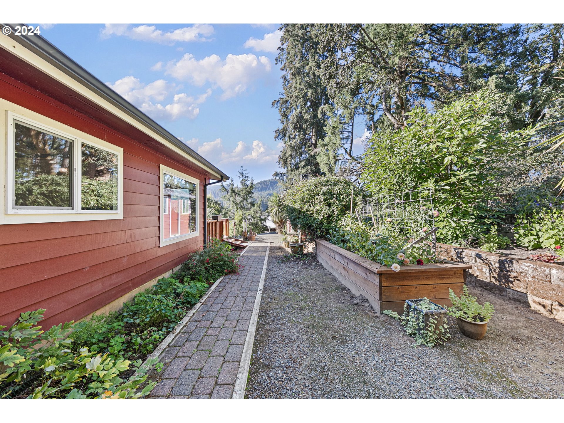 37797 Worth Road Springfield, OR 97478 - Photo 35 of 47 a view of a backyard with potted plants and large tree