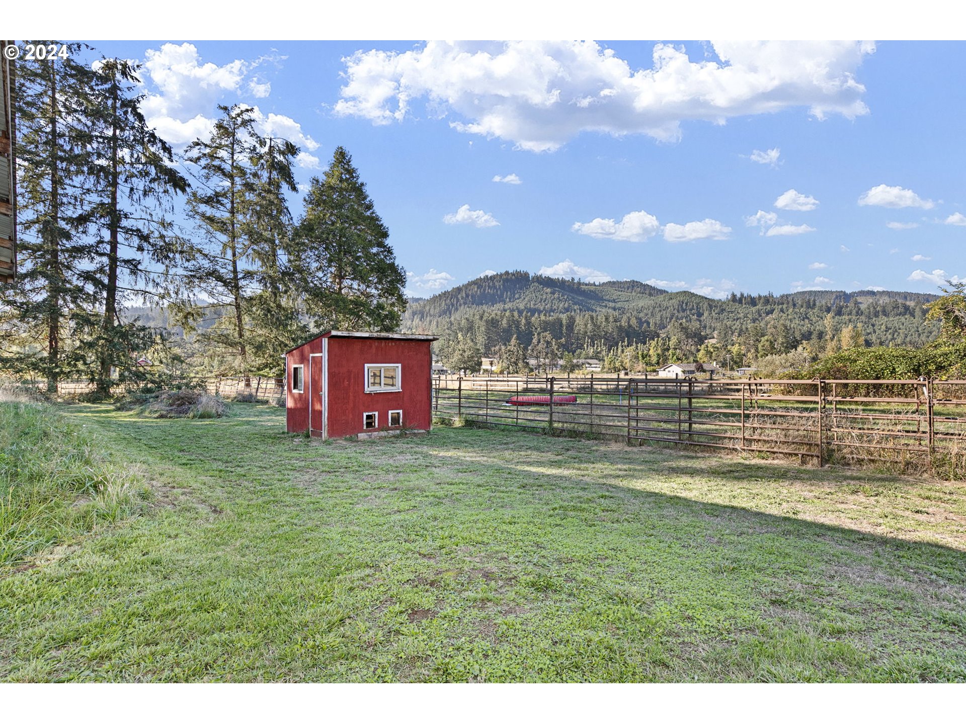 37797 Worth Road Springfield, OR 97478 - Photo 43 of 47 a view of a big yard with a house in the background