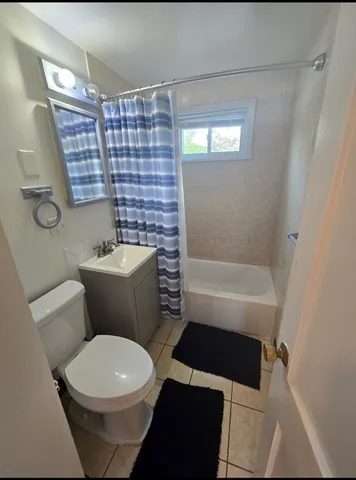 a bathroom with a toilet a sink and bathtub