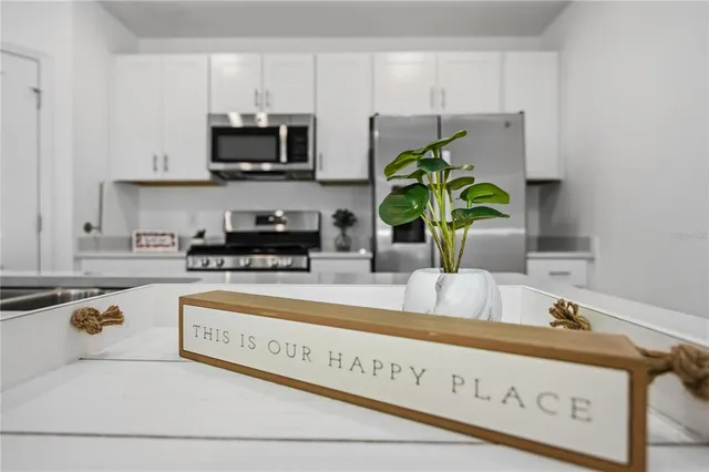 a kitchen with sink and cabinets