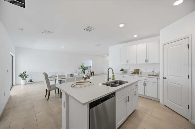 a white toilet sitting next to a bathroom sink